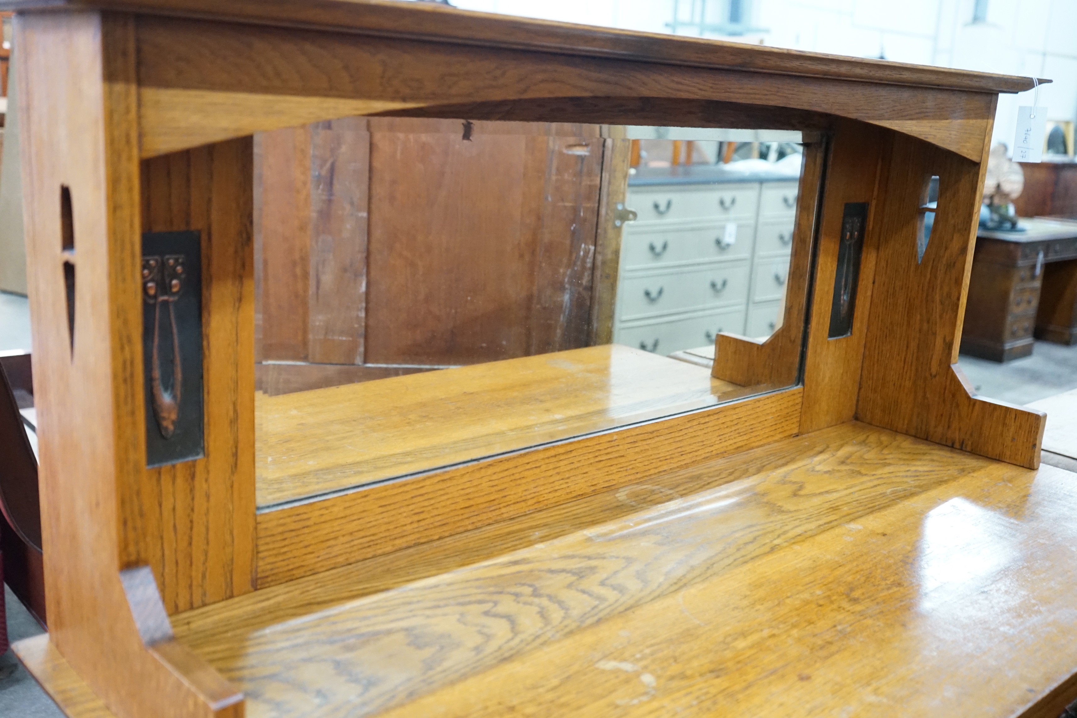 An Art Nouveau oak mirror back sideboard, length 122cm, depth 55cm, height 145cm